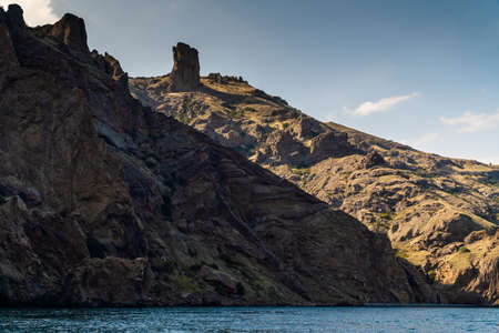 The Crimean Peninsula. July 21, 2021. Picturesque view of the high cliffs at Cape Karagach from the Black Sea.の写真素材