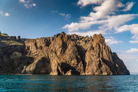 The Crimean Peninsula. July 21, 2021. Picturesque view of the high cliffs at Cape Karagach from the Black Sea.の写真素材