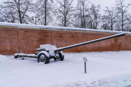Russia. Kronstadt, January 28, 2022. Snow-covered MT-12 anti-tank gun of 100 mm caliber. as an exhibition exhibit in Patriot Park.のeditorial素材