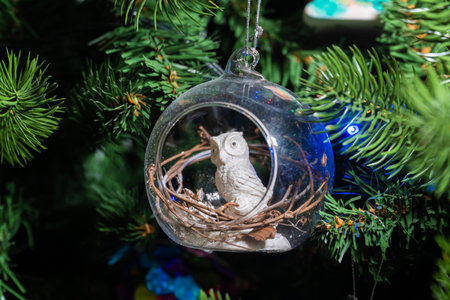 Russia. Kronstadt. January 19, 2023. Festive decoration owl in a ball on the Christmas tree.の写真素材