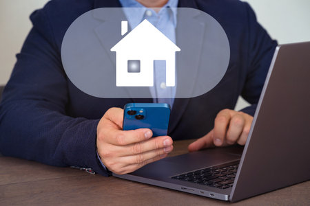 Remote control of a smart home from a smartphone. The concept of a smart home. The control button for the smart home system application.の写真素材