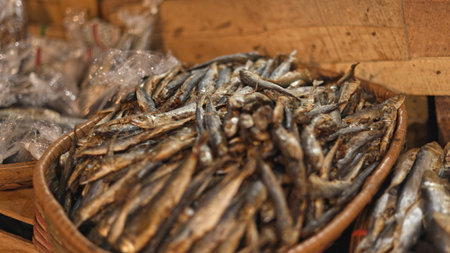 Dried fish market display bustling local stall evokes authentic charm, dried fish market display showcases vibrant row with colorful basket variety, healthy scene, good for street food vendor contentの写真素材