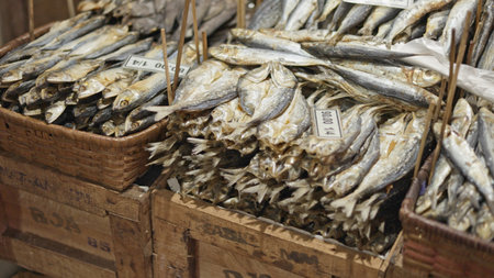 Traditional dried fish baskets pan street food vendors market, traditional dried fish baskets reveal fresh row with vibrant catch colorful scene pan moment, excellent for traditional cooking tutorialsの写真素材