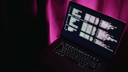 Bright code display, Nighttime development environment featuring vibrant hues and playful experimentation, Dark room illuminated by luminous computer screen showcasing dynamic programming activitiesの写真素材