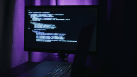 Tech workspace ambiance, Serene night setting featuring programmer correcting code errors diligently Tranquil latenight IT scene displaying developer addressing coding issues under violet illuminationの写真素材
