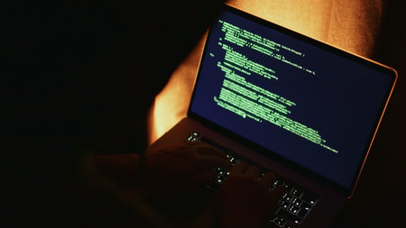 Analyzing suspicious system activity carefully, Security specialist reviewing alarming system logs attentively, Expert analyzing suspicious terminal data with focused intent andの写真素材