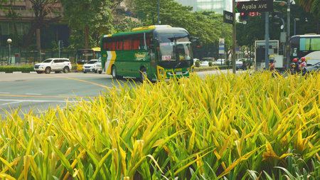 City street bustle, lively metropolitan intersection teeming with people and moving vehicles today, an active urban junction bustling with diverse pedestrians and busy vehicularのeditorial素材