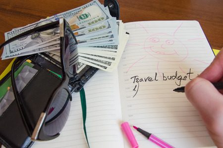Preparing for the trip. budget for travel. List and money. How much money is needed to travel abroad.の写真素材