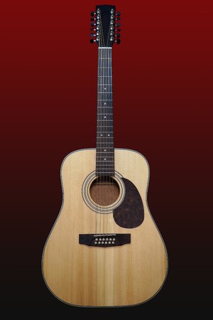 Twelve-string guitar on a black and red gradient backgroundの写真素材