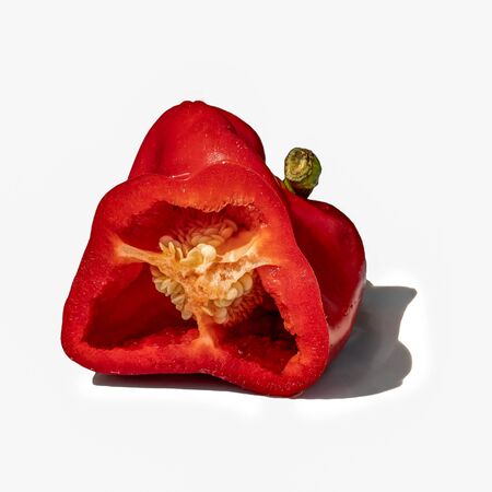 Red pepper in cross section. Isolate on white backgroundの写真素材