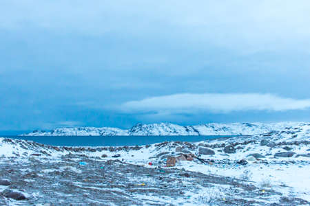Snow plains on the Barents sea coast beyond the Arctic circle in the far North in the Murmansk region the village of Teriberka in the cold winterの写真素材