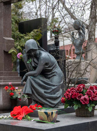 Moscow Russia - april 17 2022: Stone statue of a woman on a grave at the Novodevichy Cemeteryのeditorial素材