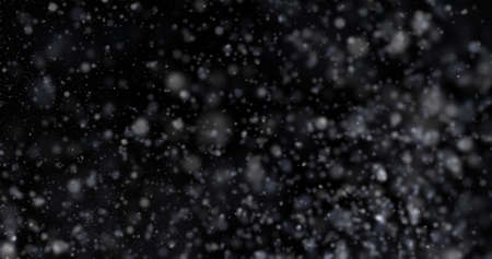 Natural white winter snowfall on a black background 3d rendering Snowstorm magic motion design wallpaperの写真素材