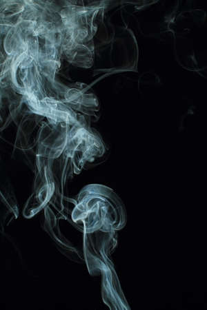 Abstract white smoke texture on black background Plume of smoke wave design wallpaperの写真素材