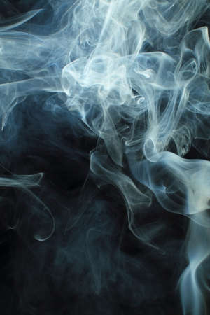 Abstract white smoke texture on black background Plume of smoke wave design wallpaperの写真素材