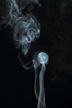 Abstract white smoke texture on black backgroundの写真素材