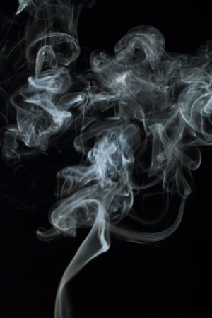 Abstract white smoke texture moves on black background Plume of smoke wave design wallpaper. Design element. Abstract textureの写真素材