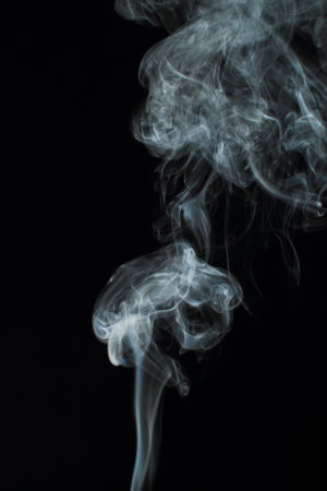 Abstract white smoke texture moves on black background Plume of smoke wave design wallpaper. Design element. Abstract textureの写真素材