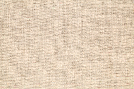 Natural Linen Material Textile Canvas Fabric Texture Background Close-up Detail of Fabric Natural Color Hemp Material Pattern Design Wallpaper.の写真素材