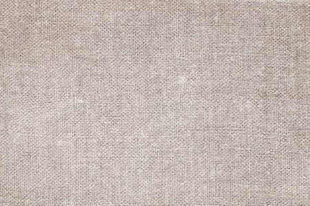 Natural Linen Material Textile Canvas Fabric Texture Background Close-up Detail of Fabric Natural Color Hemp Material Pattern Design Wallpaper. Can be Used as Background or For Graの写真素材