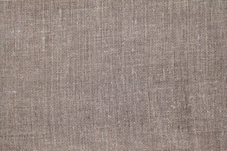 Natural Linen Material Textile Canvas Fabric Texture Background Close-up Detail of Fabric Natural Color Hemp Material Pattern Design Wallpaper. Can be Used as Backgroundの写真素材