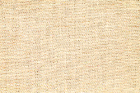 Natural Linen Material Textile Canvas Fabric Texture Background Close-up Detail of Fabric Natural Color Hemp Material Pattern Design Wallpaper. Can be Used as Backgroundの写真素材