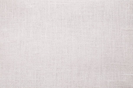 Natural Linen Material Textile Canvas Fabric Texture Background Close-up Detail of Fabric Natural Color Hemp Material Pattern Design Wallpaper. Can be Used as Backgroundの写真素材