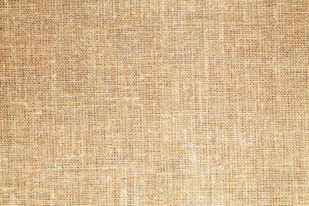 Natural Linen Material Textile Canvas Fabric Texture Background Close-up Detail of Fabric Natural Color Hemp Material Pattern Design Wallpaper. Can be Used as Backgroundの写真素材