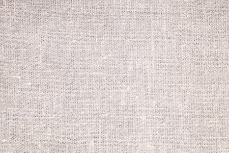 Natural Linen Material Textile Canvas Fabric Texture Background Close-up Detail of Fabric Natural Color Hemp Material Pattern Design Wallpaper. Can be Used as Backgroundの写真素材