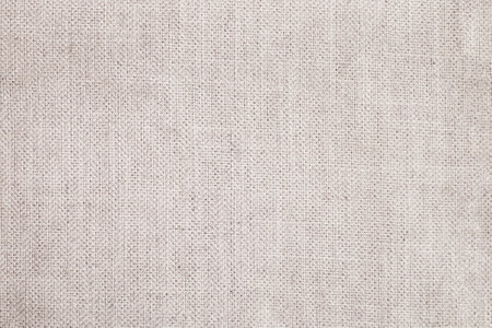 Natural Linen Material Textile Canvas Fabric Texture Background Close-up Detail of Fabric Natural Color Hemp Material Pattern Design Wallpaper. Can be Used as Backgroundの写真素材
