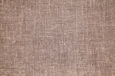 Natural Linen Material Textile Canvas Fabric Texture Background Close-up Detail of Fabric Natural Color Hemp Material Pattern Design Wallpaper. Can be Used as Backgroundの写真素材