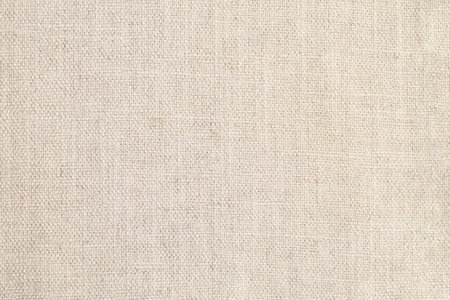 Natural Linen Material Textile Canvas Fabric Texture Background Close-up Detail of Fabric Natural Color Hemp Material Pattern Design Wallpaper. Can be Used as Backgroundの写真素材