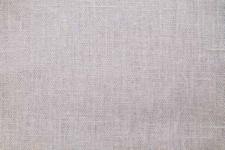 Natural Linen Material Textile Canvas Fabric Texture Background Close-up Detail of Fabric Natural Color Hemp Material Pattern Design Wallpaper. Can be Used as Backgroundの写真素材