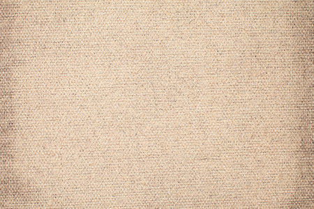 Natural Linen Material Textile Canvas Fabric Texture Background Close-up Detail of Fabric Natural Color Hemp Material Pattern Design Wallpaper. Can be Used as Backgroundの写真素材
