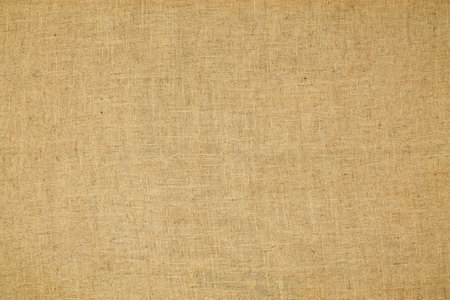 Natural Linen Material Textile Canvas Fabric Texture Background Close-up Detail of Fabric Natural Color Hemp Material Pattern Design Wallpaperの写真素材