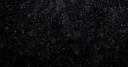 Snow on a black background. Snowflakes on a black backgroundの写真素材