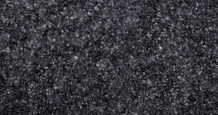 Snowflakes on a black background. Winter background. Snowfall.の写真素材