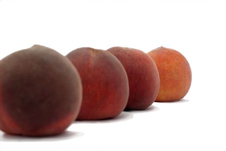Peaches isolated over whiteの写真素材