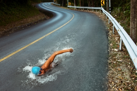 Strong Man Swim On Asphalt Road Strong Man Swim On Asphalt Road