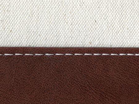 two textile materials jointed by white threadの写真素材