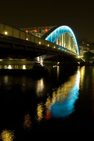 night iron-bridge and reflection in riverの写真素材