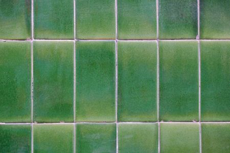  detailed green ceramic tile wall background with pale color tones