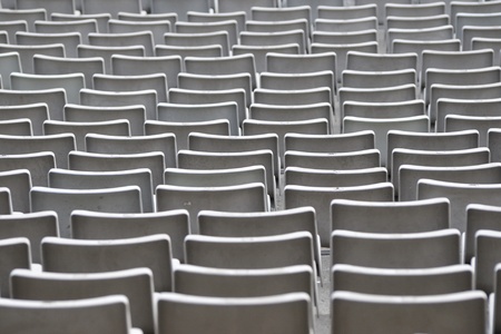 empty plastic chairs rows on the sport stadiumの写真素材