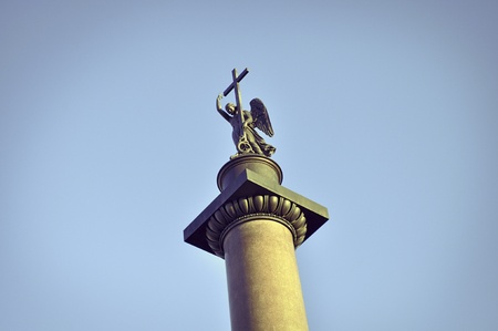 top of famous Alexander Column, showing statue of an angel holding a cross. Monument is placed on Palace Square of St.Petersburgのeditorial素材