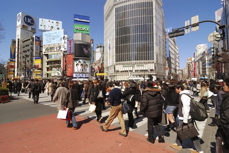 Tokyo, Japan - March 6,  2008 : Pedestrian crowd cross the famous Shibuya street crossing in Tokyo....