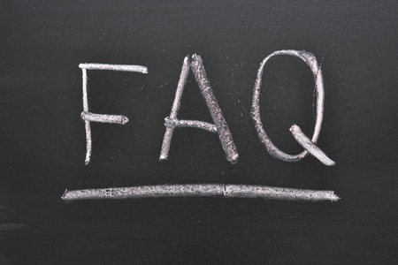 abbreviation FAQ handwritten on black chalkboardの写真素材