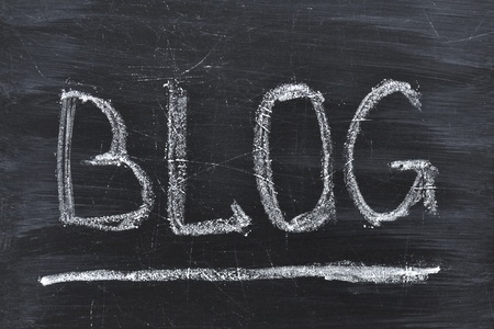 Blog word handwritten on the black chalkboardの写真素材