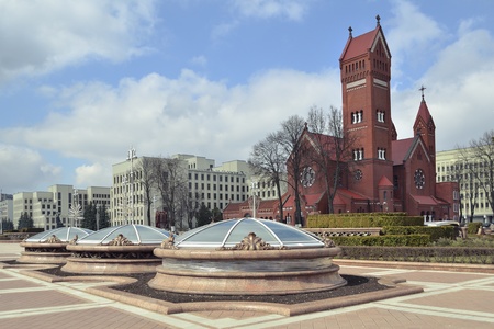 sunny day view to the Nezalezhnascy Square and famous Red Church in Minsk cityの写真素材