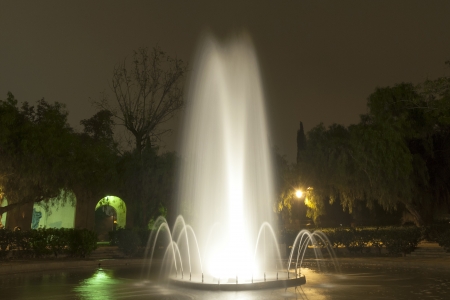 fountain illuminated by night in famous Montjuic park in Barcelona, Spainの写真素材
