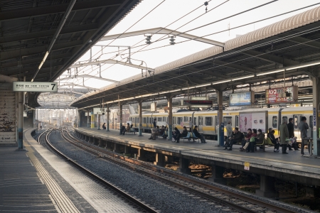 Funabashi, Japan -  March 10,  2008: Passengers wait train on the platform of Nishi-Funabashi station (????). It is the most-eastern station of the Tokyo subway network connected to trains network of Chiba prefecture.のeditorial素材
